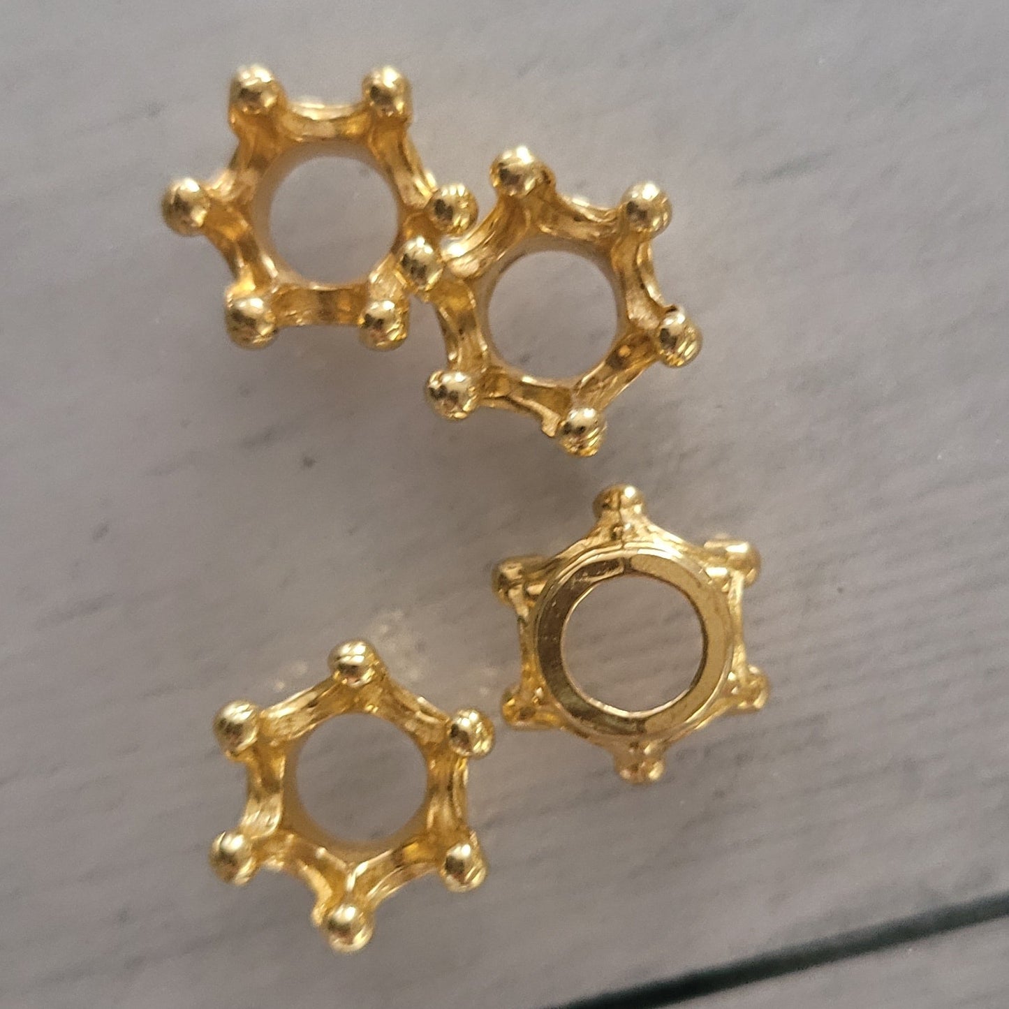 Small gold crowns