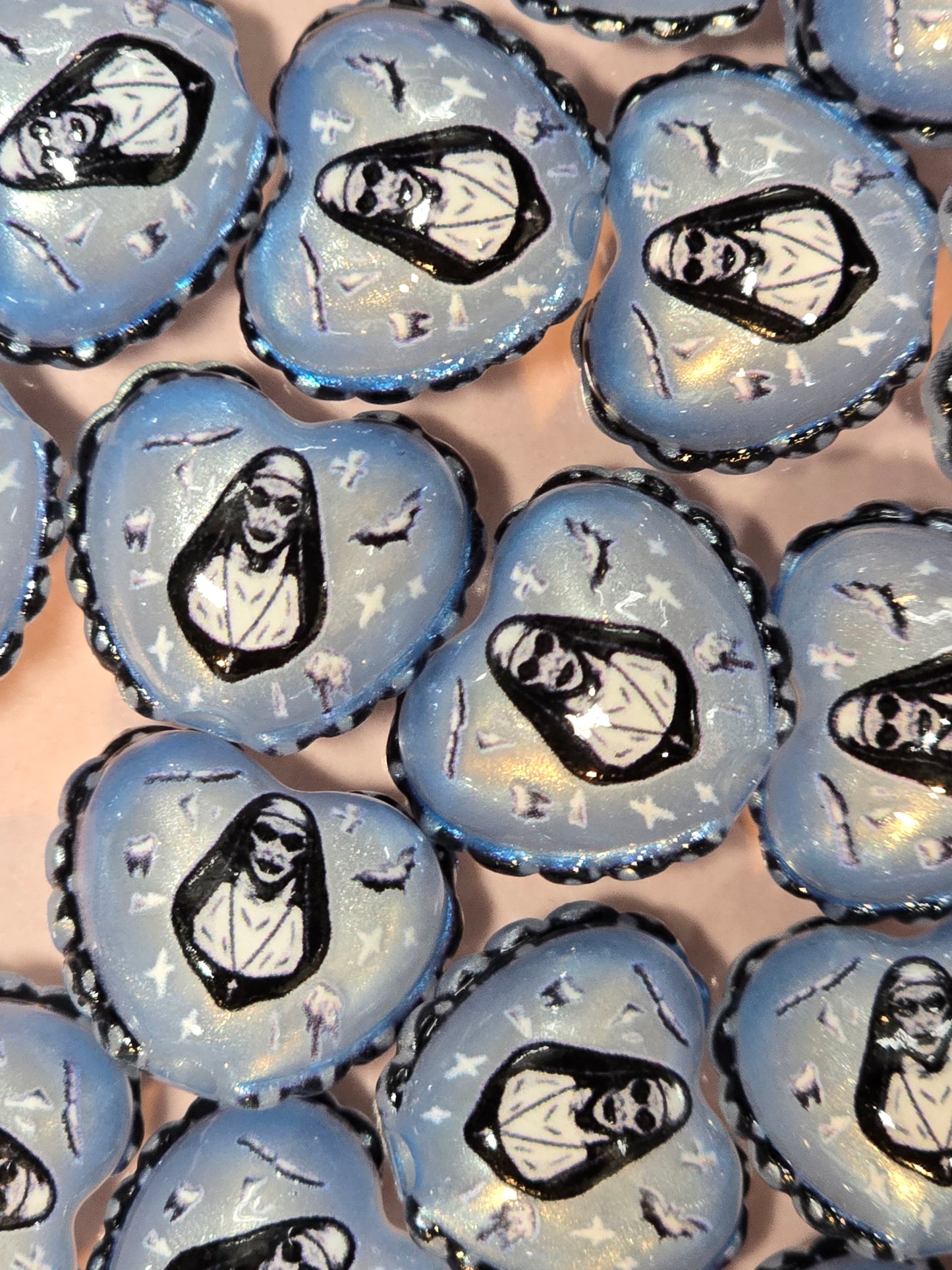 Acrylic scary nun heart beads