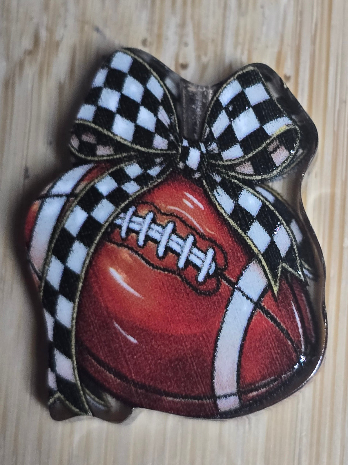 Acrylic focal beads- football with bow