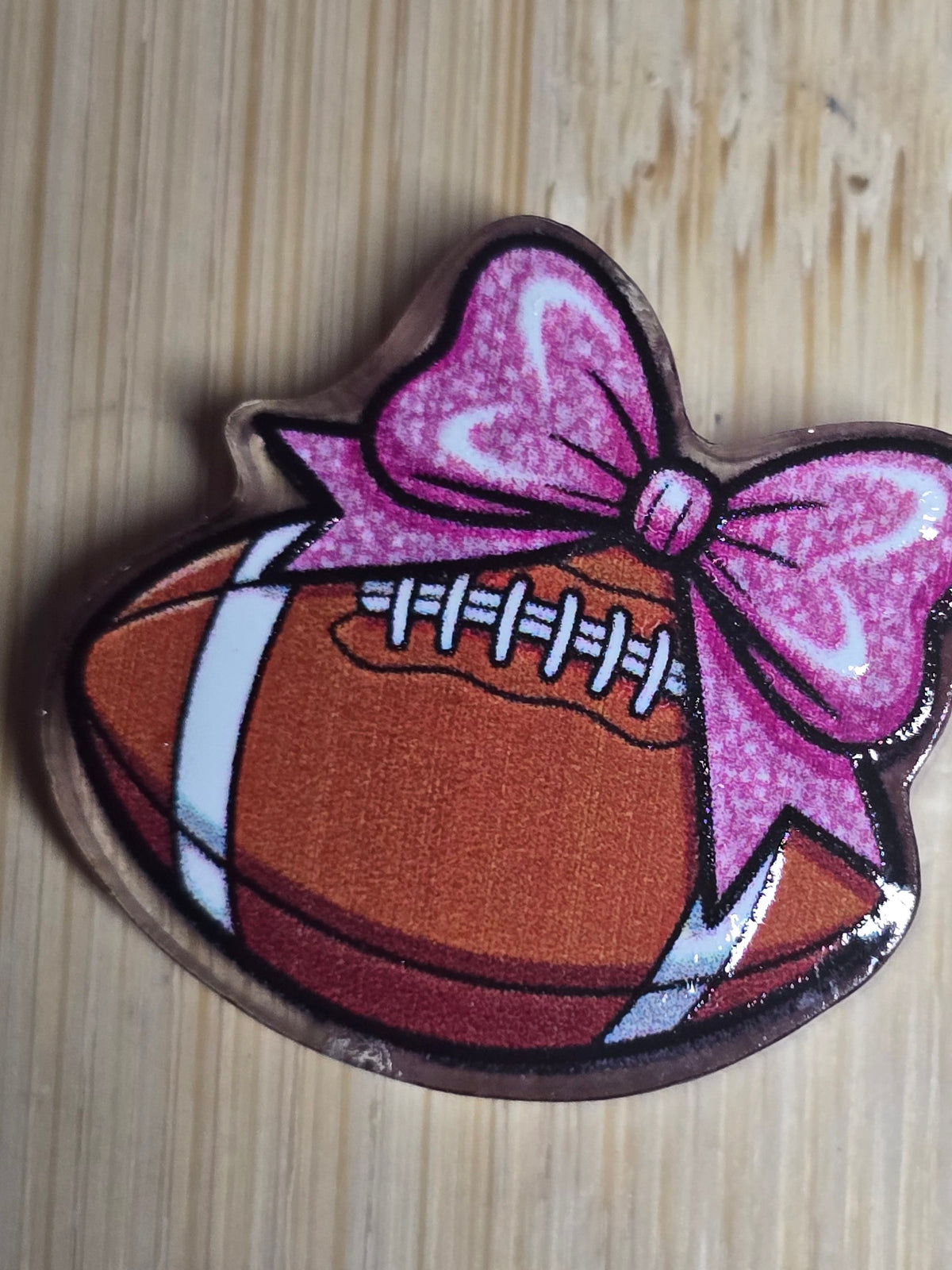 Acrylic focal beads- football with bow