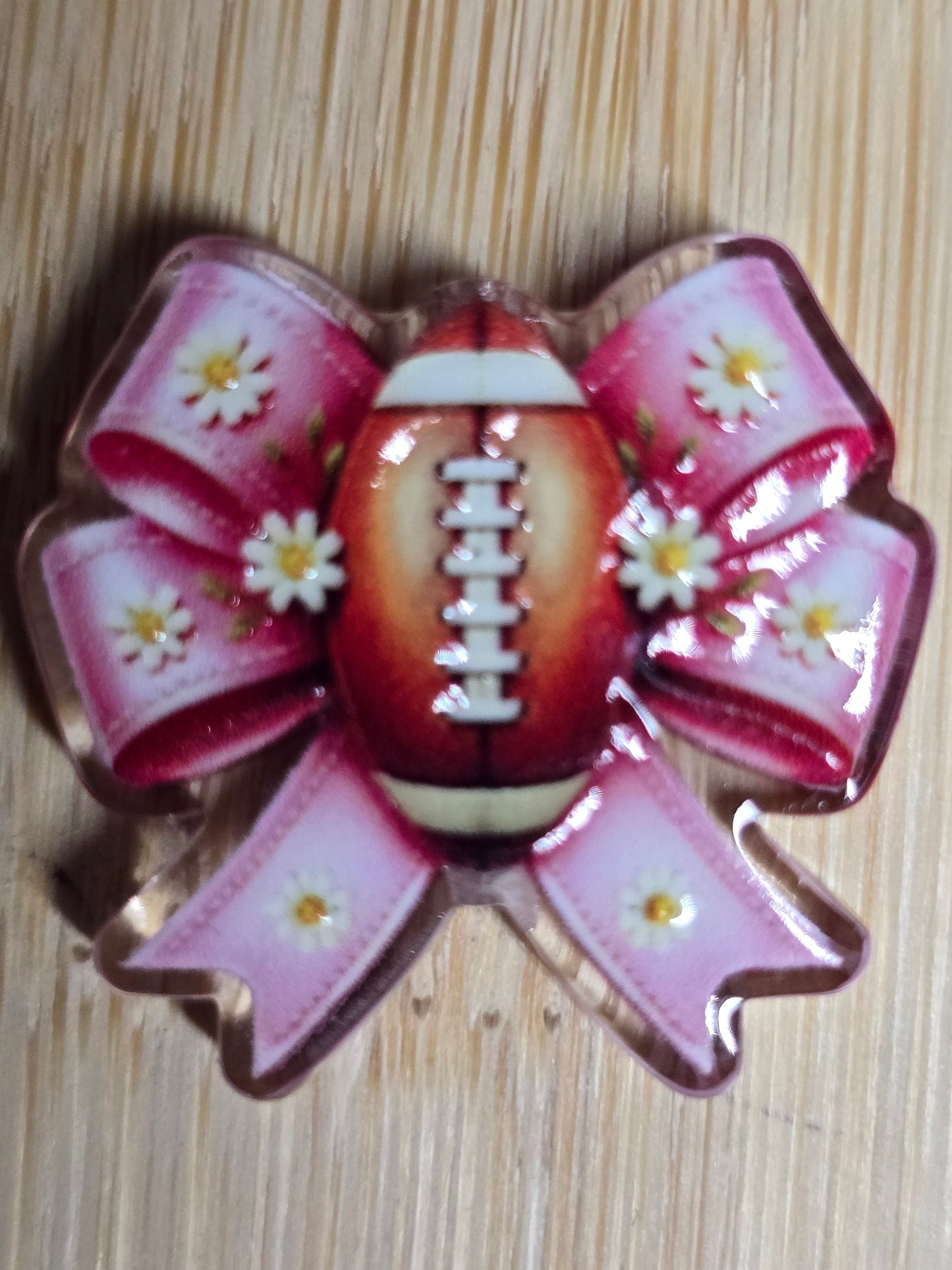 Acrylic focal beads pink bow with white daisies and a football center