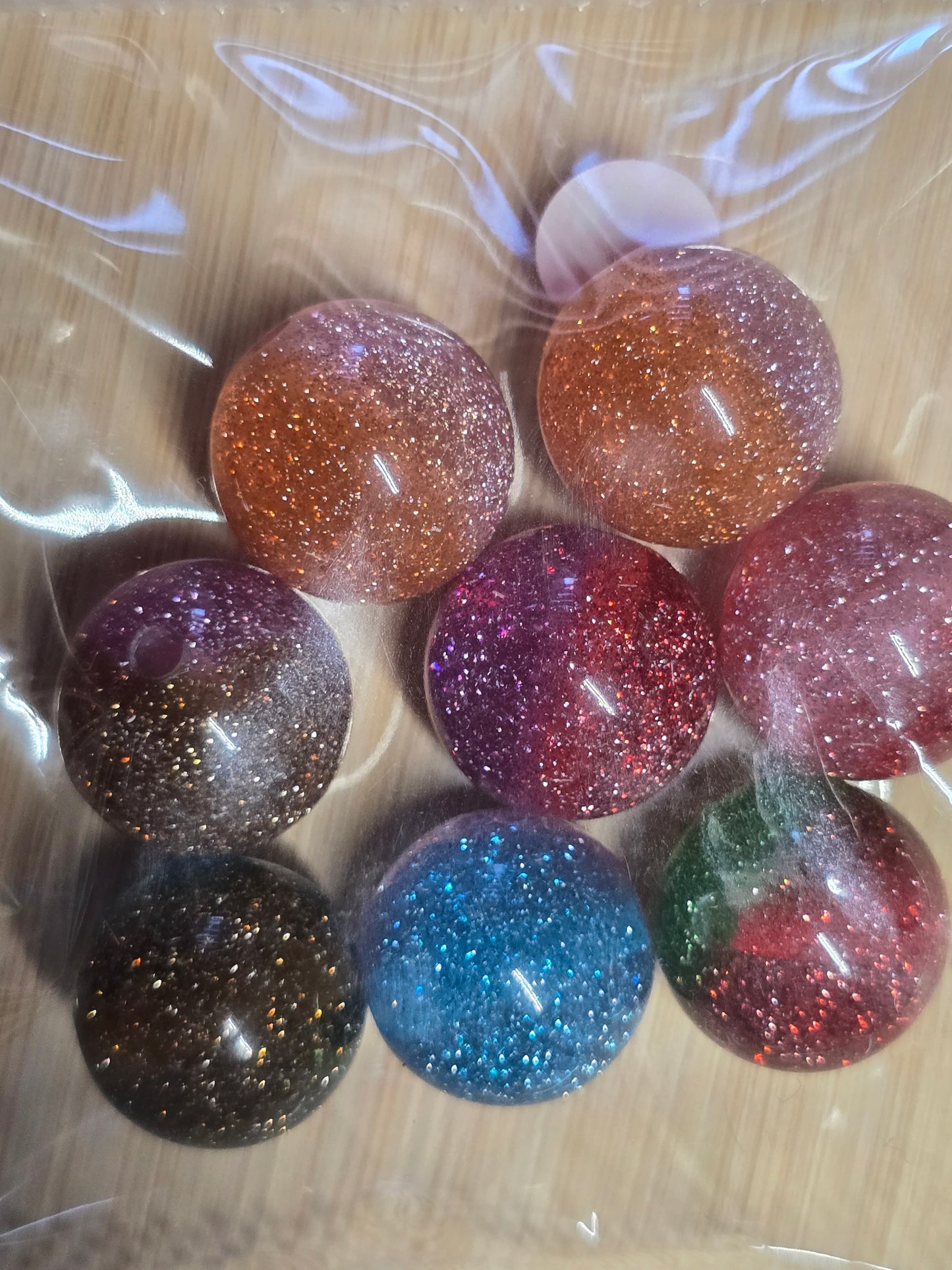 Small packs of acrylic beads